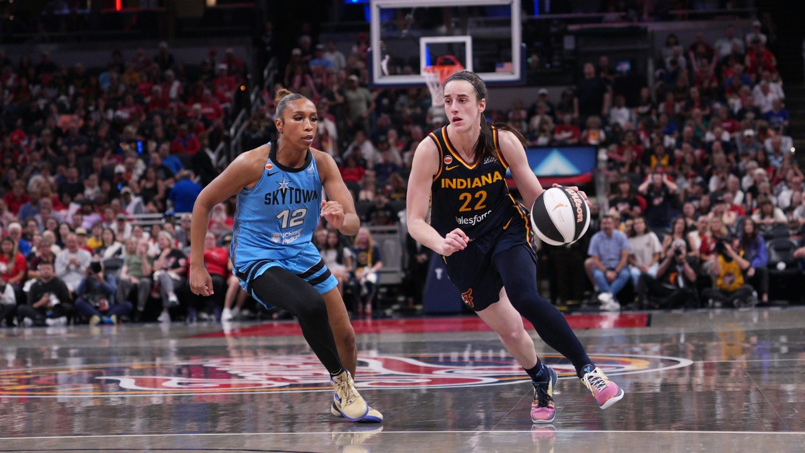 WNBA players compete during an official league game