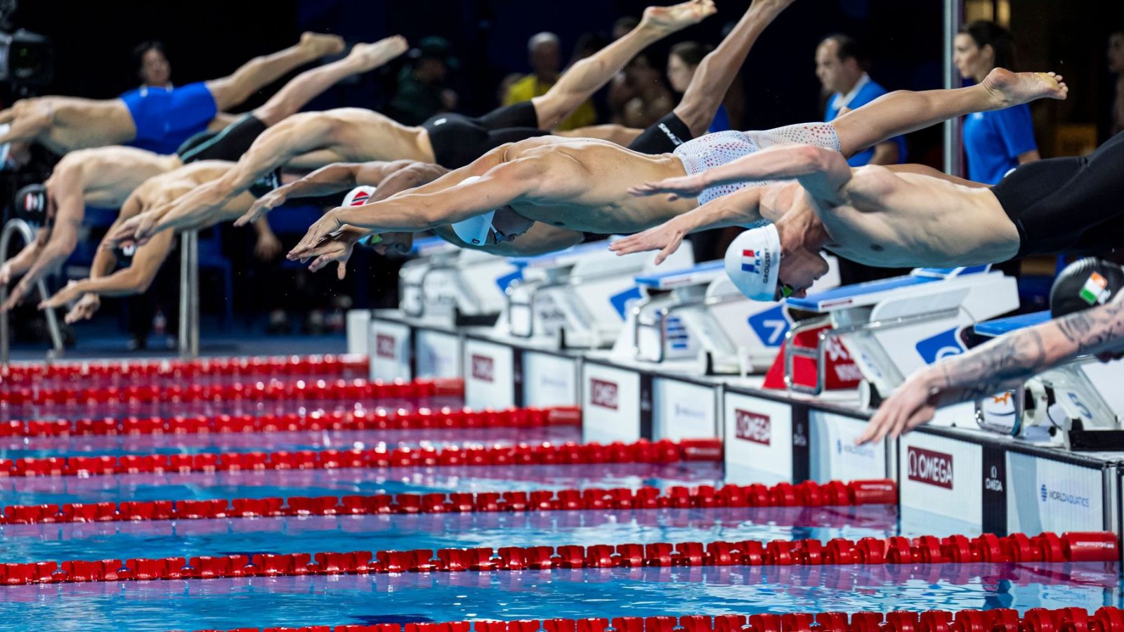 Swimmers racing in the men's 50m freestyle heats at the World Aquatics Swimming Championships